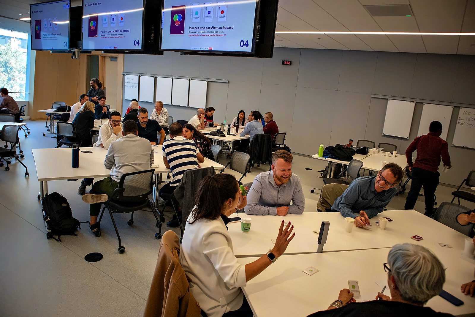 A Hydro-Québec workshop: a room of tables playing at once