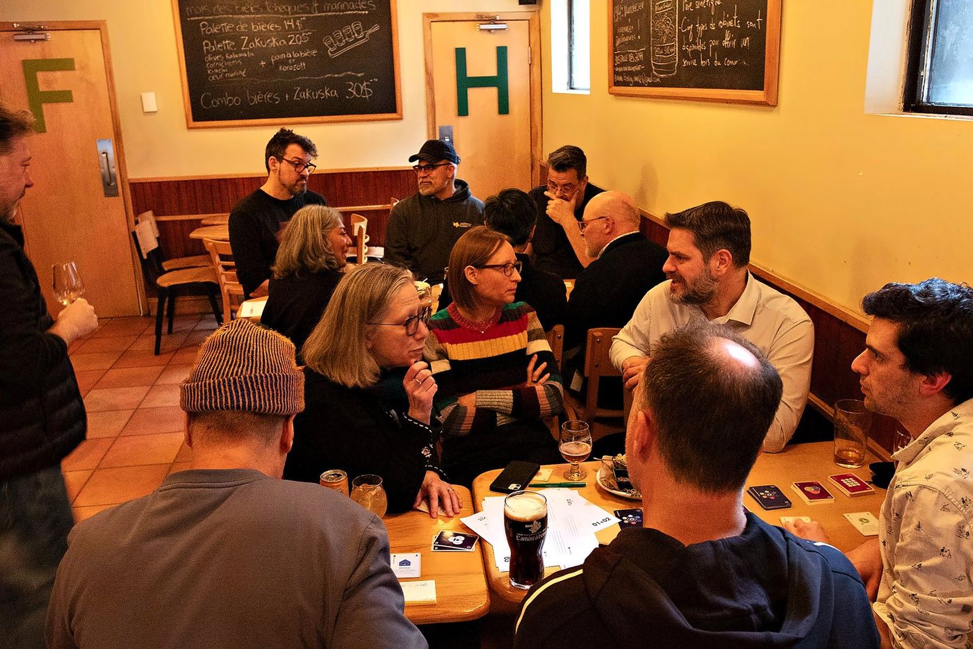 A beta test of the AI extension: two tables of players in a pub